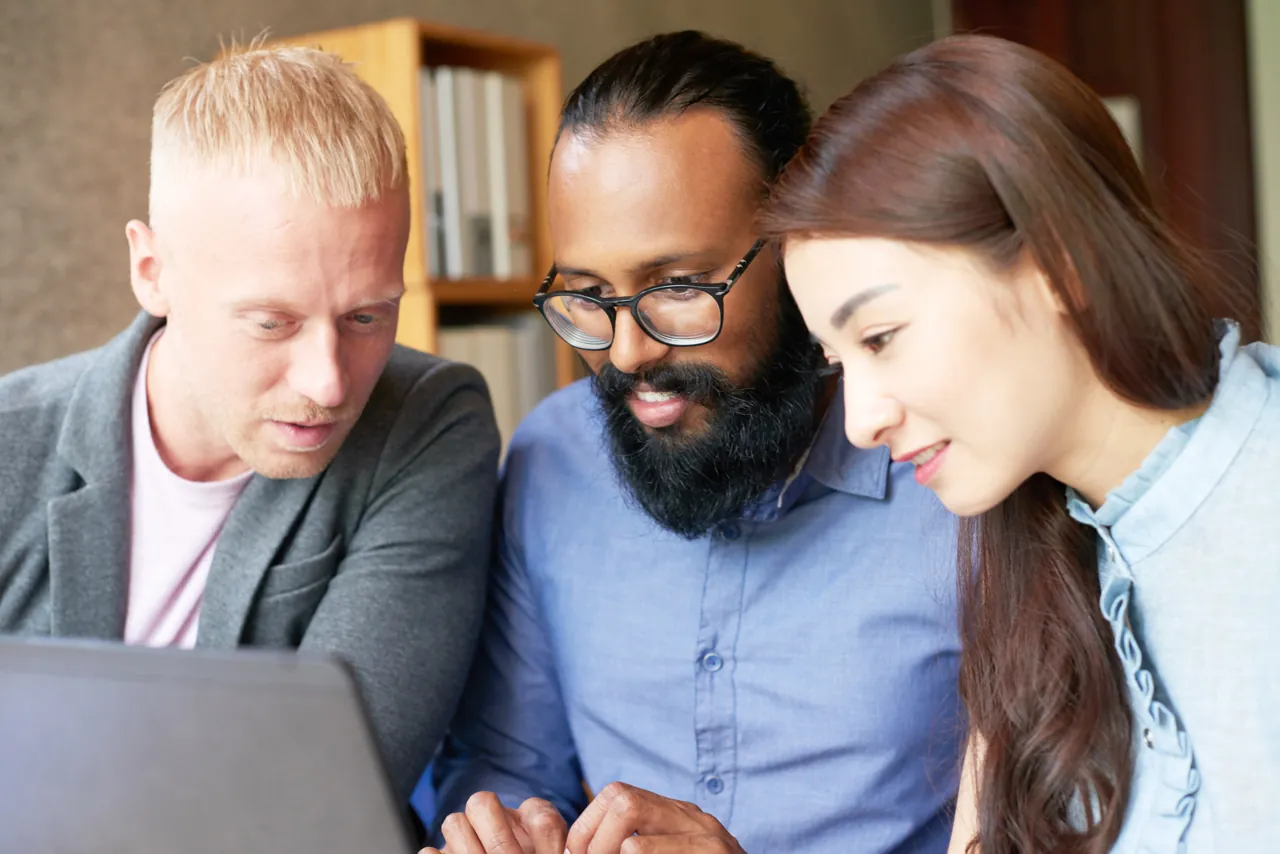 A software team reviewing an application together to validate it meets requirements