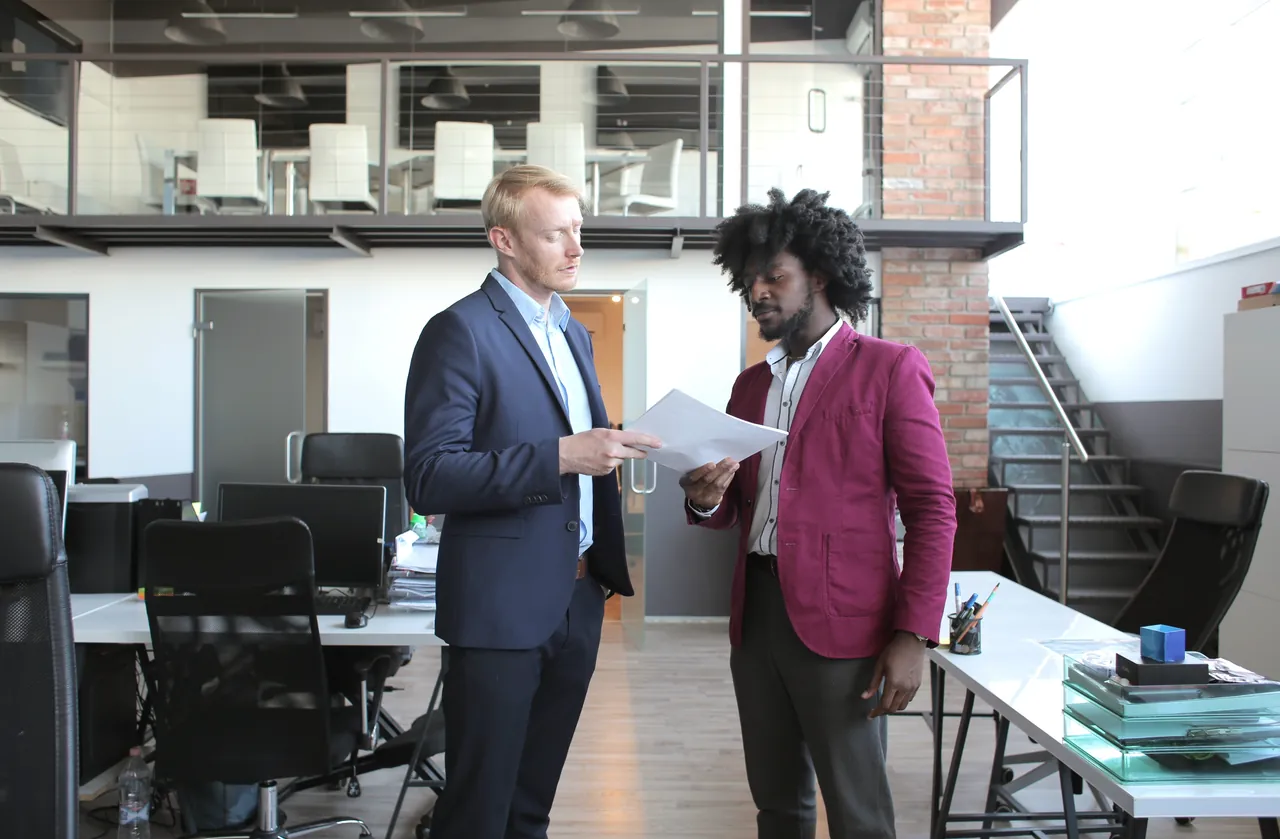 QA and procurement leads reviewing a test automation RFP response during a vendor evaluation meeting