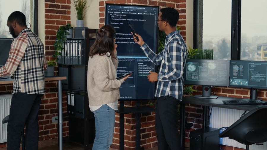 Engineering team tracing and debugging a multi-agent system on a shared screen